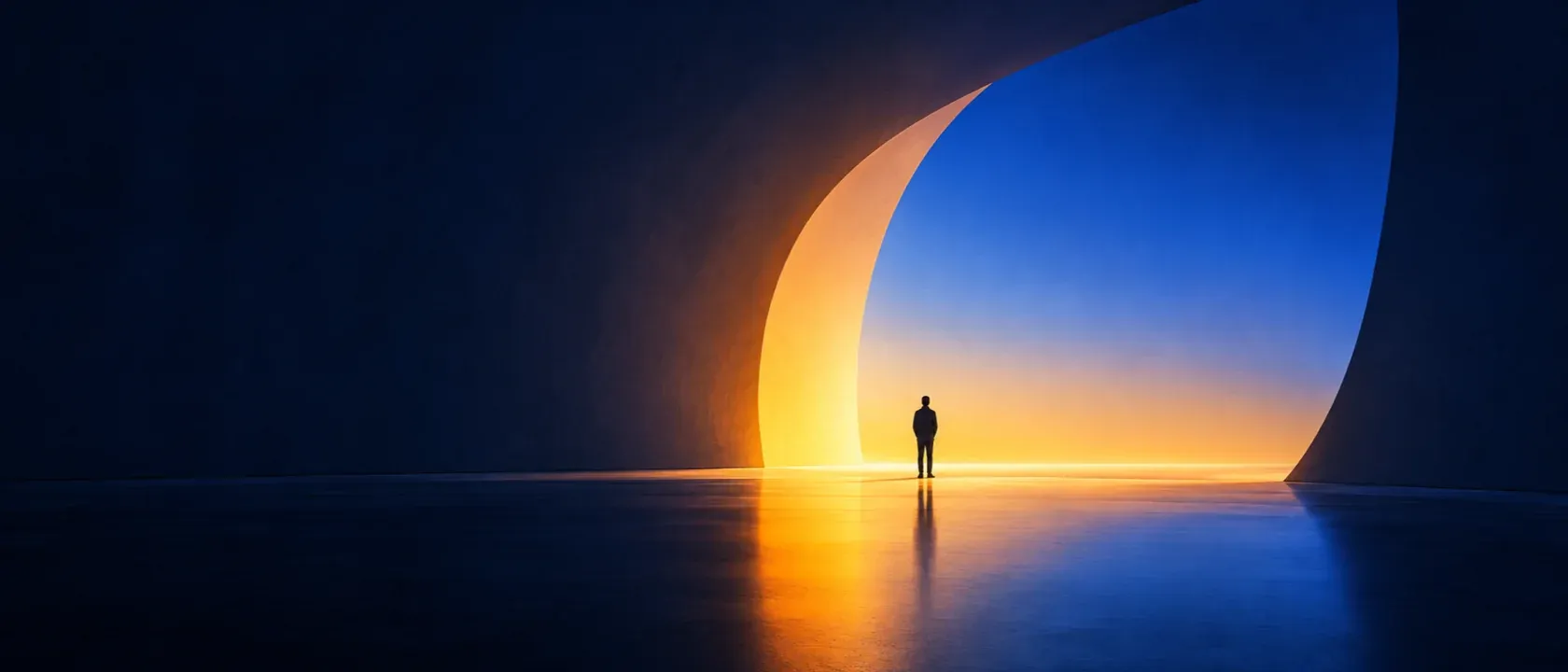 A lone figure standing in a vast curved opening in a dark wall, its edge lit amber, with blue light beyond.