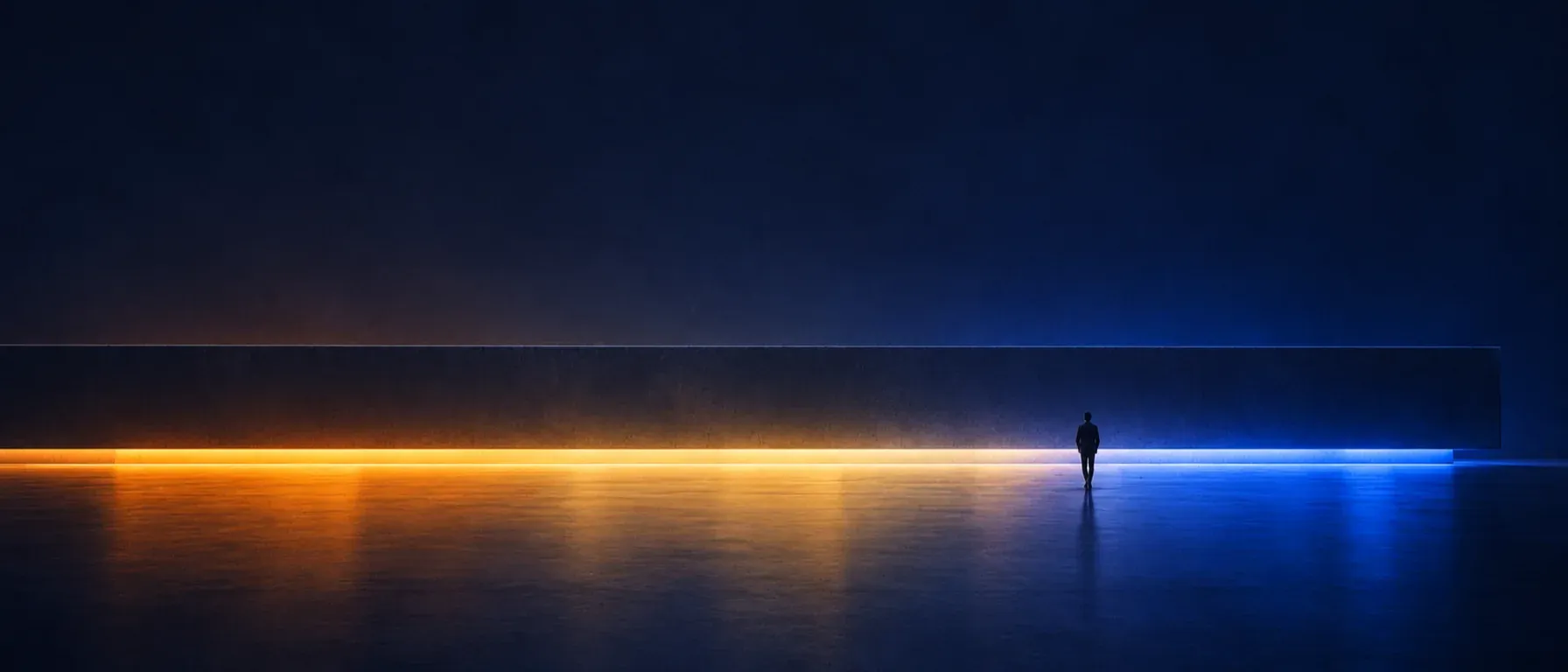 A lone figure before a long, level slab, with a continuous line of light beneath it running from amber to blue.